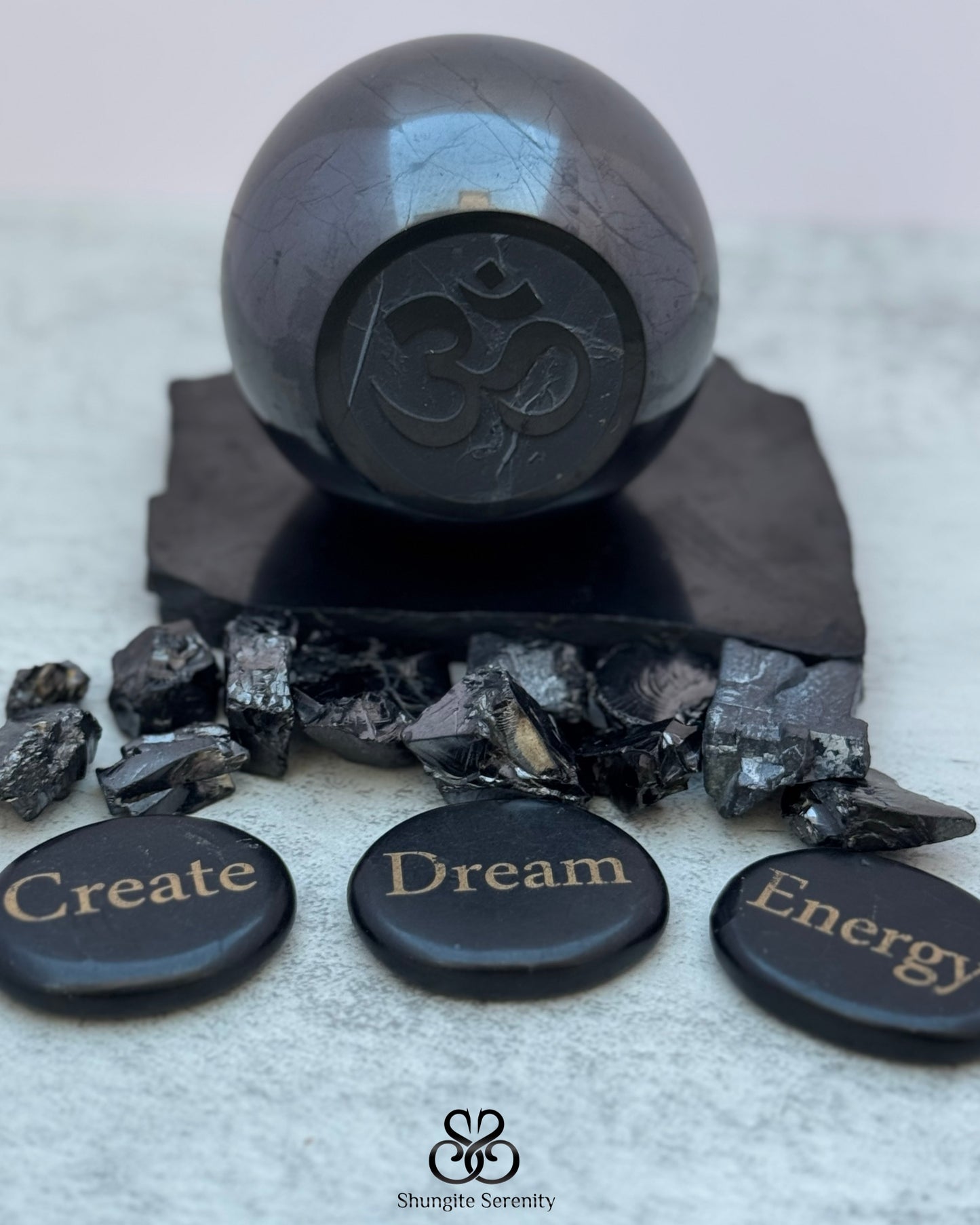 Shungite sphere w engraved Om Symbol