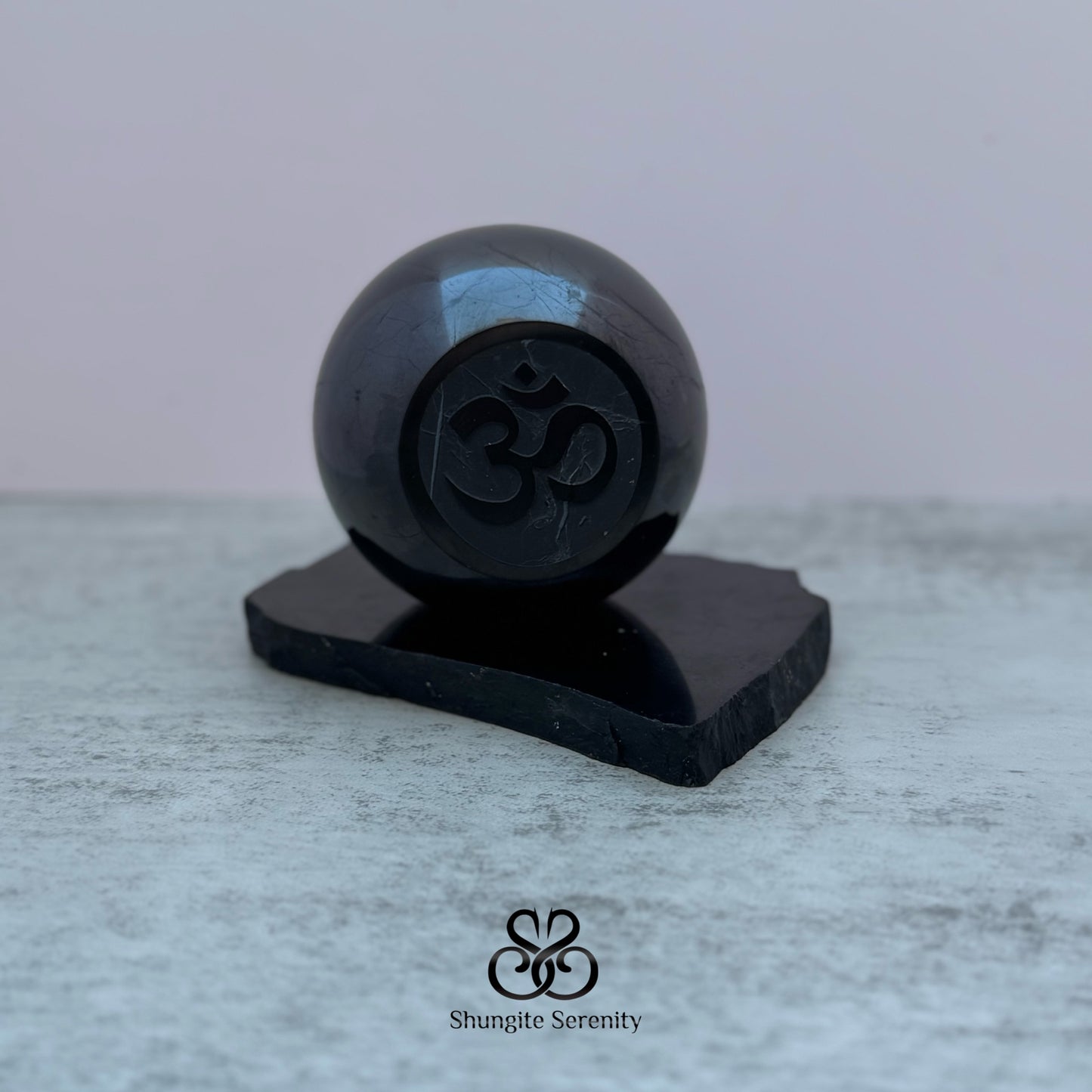Shungite sphere w engraved Om Symbol